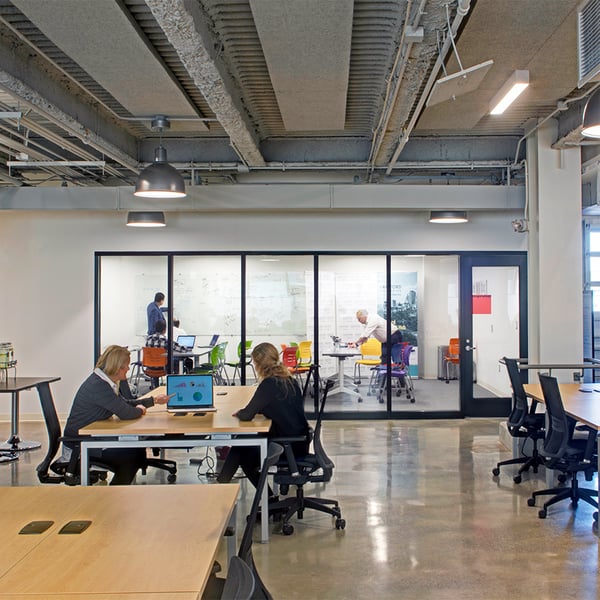 An office interior with people working at desks