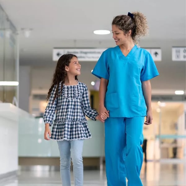 Adult and child walking through healthcare environment